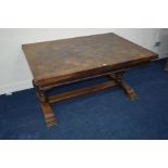 AN EARLY 20TH CENTURY OAK PARQUETRY TOPPED DRAW LEAF TABLE, on a floor level stretcher, width