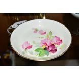 A ROYAL WORCESTER PIN DISH, florally painted, signed K. Blake, diameter approximately 11.5cm