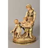 A TURN (BOHEMIA) PORCELAIN FIGURE GROUP, mother and children, with gilt detailing, approximate