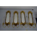 A SET OF FOUR LATE 20TH CENTURY GILT WOOD GIRANDOLES with twin branch light fitting and mirror