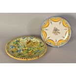 A 19TH CENTURY MAIOLICA CHARGER, painted with a border of blue and yellow dots, the centre with a