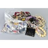 A LARGE BAG OF COSTUME JEWELLERY, to include imitation pearls, bead necklaces, earrings, bangles