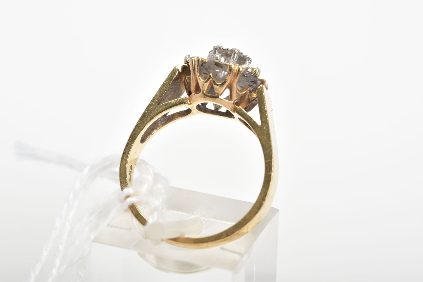 A 9CT GOLD DIAMOND CLUSTER RING, designed as a tiered cluster of single cut diamonds within illusion - Image 3 of 3