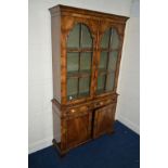 A REPRODUCTION GEORGE II STYLE MAHOGANY DOUBLE DOOR BOOKCASE, green painted interior with a single