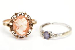 TWO 9CT GOLD RINGS, the first designed with an oval cameo panel in a scalloped and beaded surround