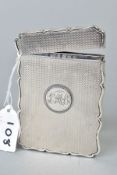 A MID VICTORIAN SILVER CARD CASE OF WAVY RECTANGULAR FORM, hinged top, engine turned decoration,