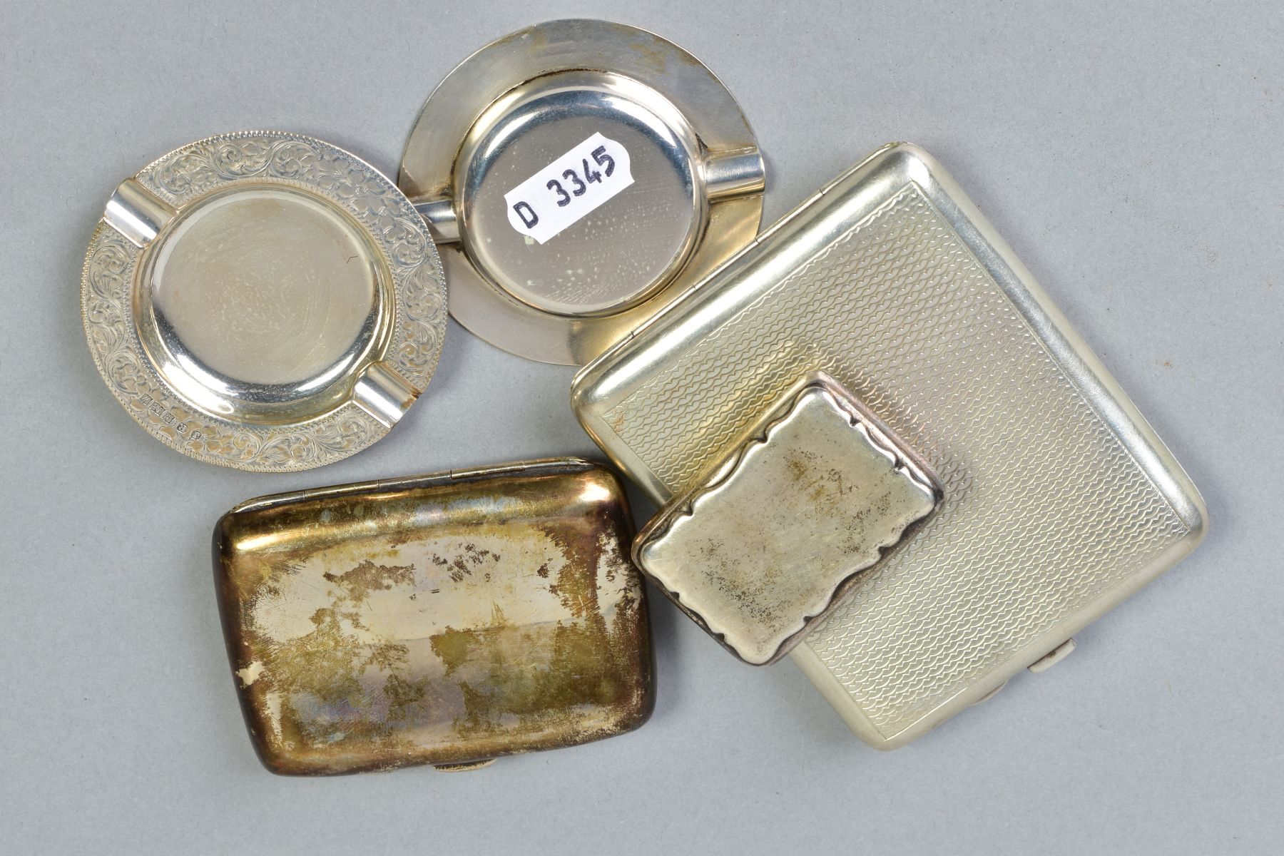 A GEORGE V SILVER CIGARETTE CASE, of bowed rectangular form, engine turned decoration, vacant