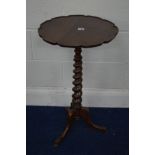 A VICTORIAN ROSEWOOD AND ROSEWOOD STAINED TRIPOD TABLE, the wavy circular top on a spiral twist