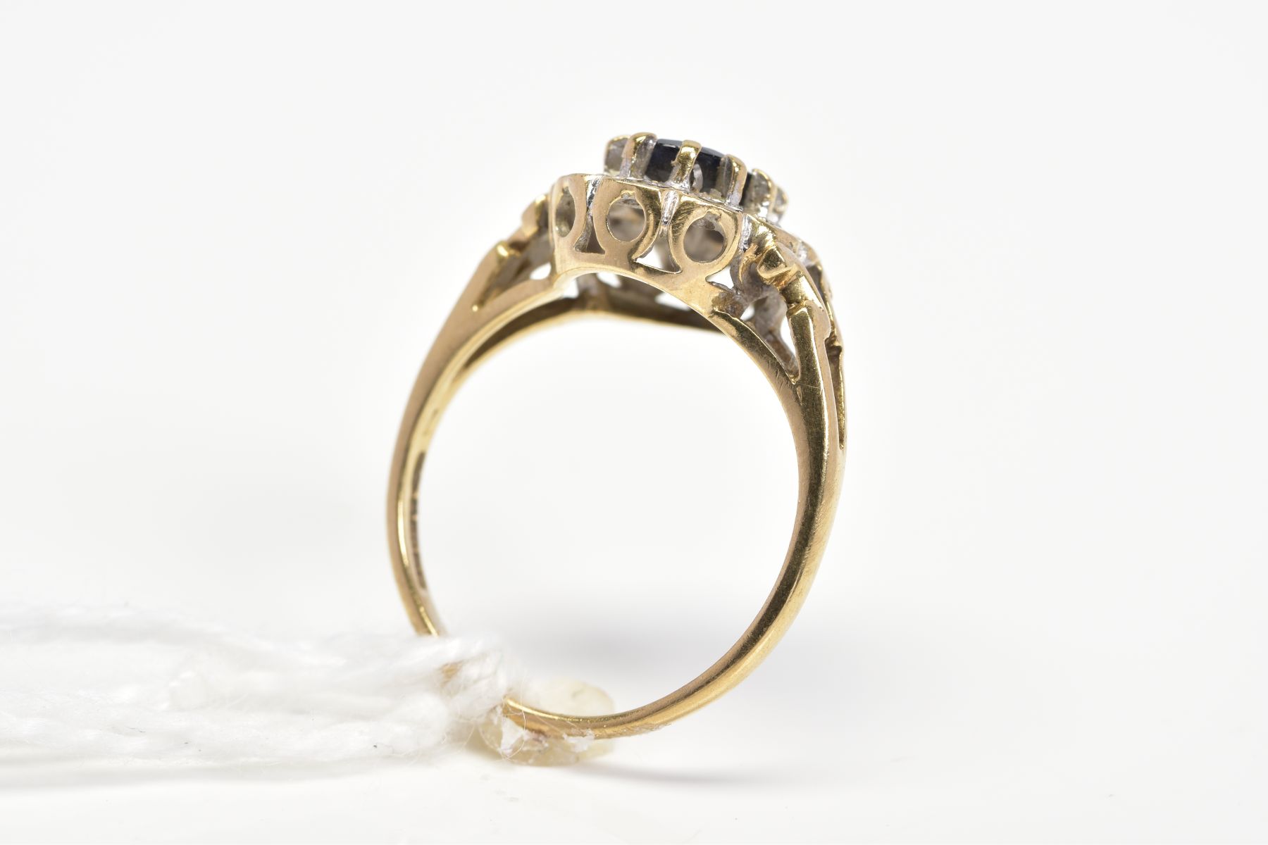 A 9CT GOLD SAPPHIRE AND DIAMOND CLUSTER RING, designed as a central oval sapphire within a single - Image 3 of 3