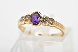 A 9CT GOLD AMETHYST AND DIAMOND RING, designed with a central oval amethyst in a collet setting with