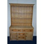 AN EARLY 20TH CENTURY PINE DRESSER, with two drawers, width 140cm x depth 48cm x height 213cm