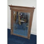 A 20TH CENTURY OAK BEVELLED EDGE OVERMANTEL MIRROR flanked by twin columns (sd)