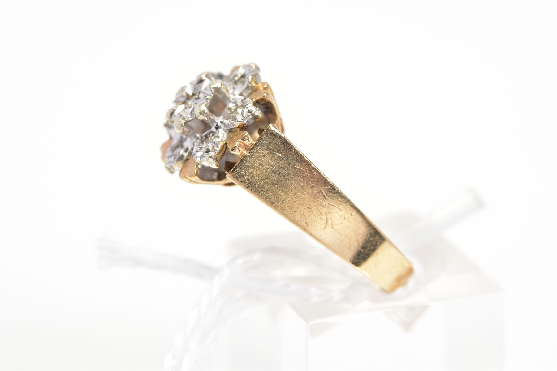 A 9CT GOLD DIAMOND CLUSTER RING, designed as a tiered cluster of single cut diamonds within illusion - Image 2 of 3