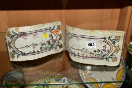 A PAIR OF 18TH CENTURY FAIENCE ROUNDED CORNER FIREPLACE TILES/BRICKS, both painted with landscapes