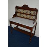 AN EDWARDIAN MAHOGANY MARBLE TOPPED WASHSTAND, with a floral tiled back and two drawers, width 107cm