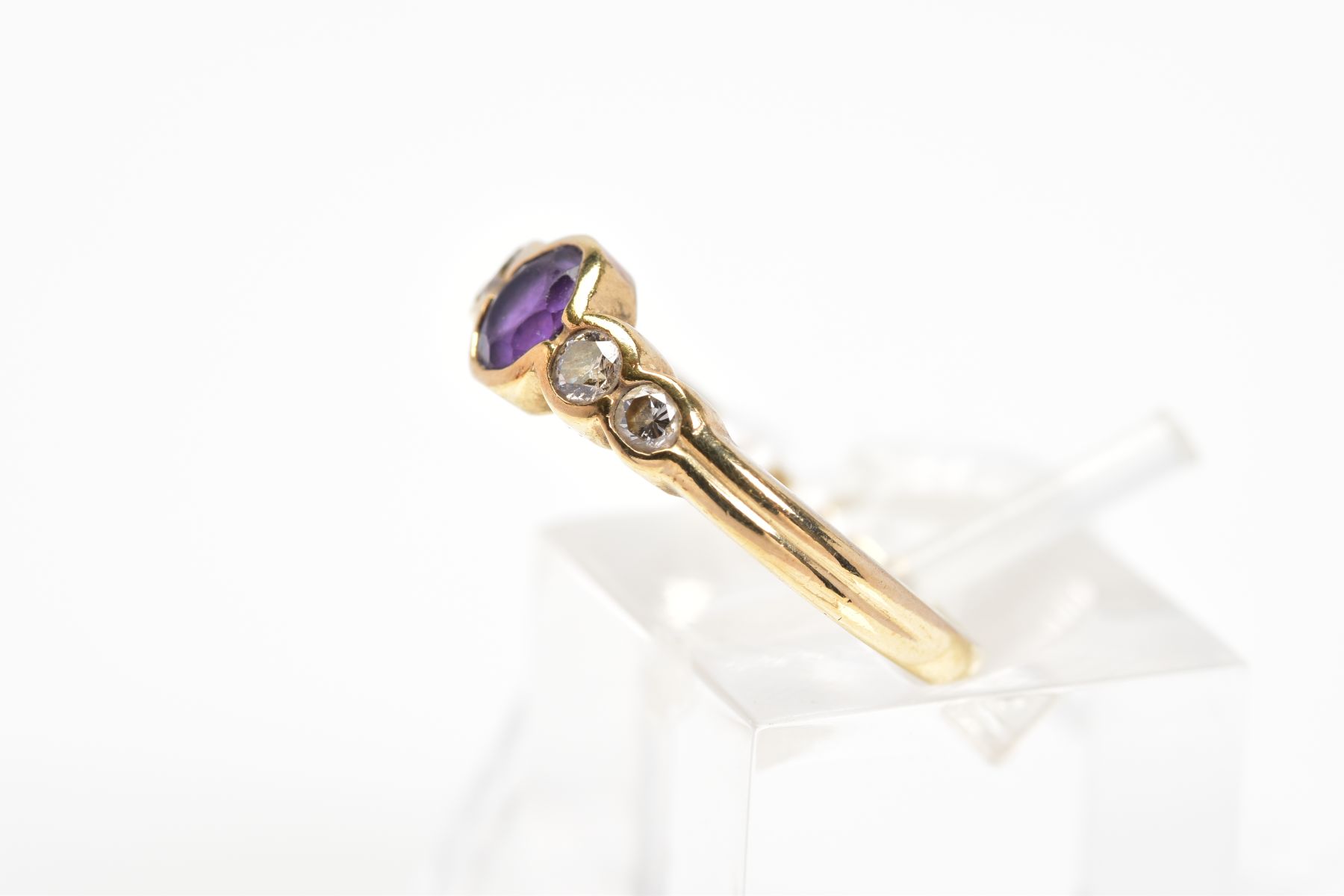 A 9CT GOLD AMETHYST AND DIAMOND RING, designed with a central oval amethyst in a collet setting with - Image 2 of 3