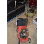 A HARRY PETROL LAWN MOWER powered by a Briggs and Stratton 3hp engine, with grass box