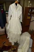 A VINTAGE COMMUNION/WEDDING DRESS, together with off cuts of fur and synthetic fur