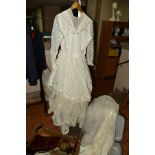 A VINTAGE COMMUNION/WEDDING DRESS, together with off cuts of fur and synthetic fur