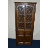 AN OLD CHARM OAK LEAD GLAZED TWO DOOR CUPBOARD, with double cupboard doors