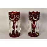 A PAIR OF VICTORIAN RUBY GLASS LUSTRES, painted floral swags and gilt detailing (rubbed) with