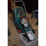 A BOSCH ROTAK 43L1 36V CORDLESS LAWN MOWER with charger, two batteries and grass box and a Bosch