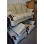 A MINT GREEN FLORAL PATTERNED THREE PIECE SUITE consisting of a three seater sofa, width 205cm,