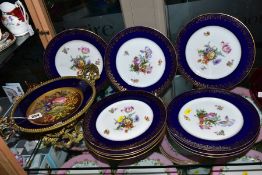 A SEVRES PORCELAIN GILT METAL TWIN HANDLED MOUNTED COMPORT, with handpainted floral decoration,