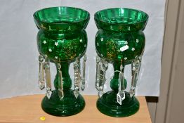 A PAIR OF GREEN CONTINENTAL GLASS LUSTRES, having gilt and white enamel floral decoration, with