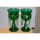 A PAIR OF GREEN CONTINENTAL GLASS LUSTRES, having gilt and white enamel floral decoration, with