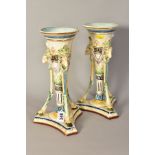 A PAIR OF CONTINENTAL MAJOLICA HUGO LONITZ VASES, of trumpet form having Rams head masks supported