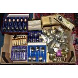 A BOX OF CASED AND LOOSE CUTLERY AND FLATWARE, etc, including a tin containing two £5 coins and