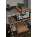A PERFORMANCE 254CM TABLE SAW sat on a converted computer stand with an extension lead, with two