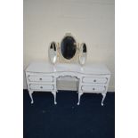 A WHITE AND GILT SERPENTINE DRESSING TABLE, with four drawers and separate triple dressing mirror