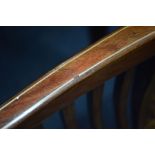 AN EDWARDIAN MAHOGANY AND INLAID ARMCHAIR with a shaped back with square spindled back and sides and