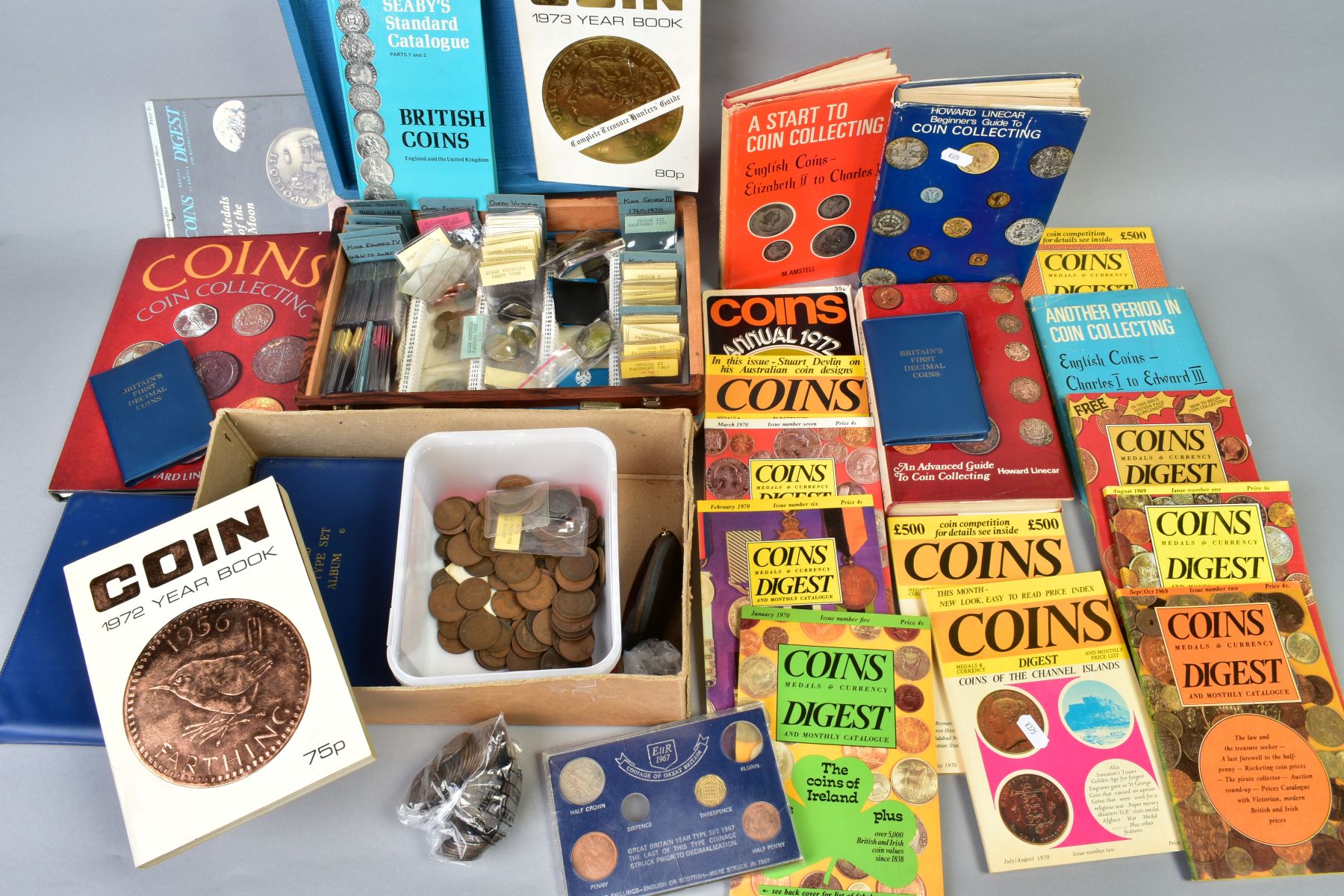 A BOX OF COINS AND COIN RELATED BOOKS, to include a high grade 1887 crown coin, etc