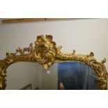 A 19TH CENTURY GESSO AND GILT WOOD OVERMANTEL MIRROR, with scrolled decoration and flower heads,