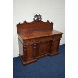 A VICTORIAN WALNUT SIDEBOARD with foliate carved raised back, three various drawers above cupboard