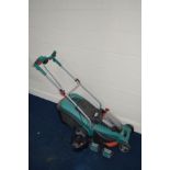 A BOSCH BATTERY POWERED LAWNMOWER with grass box, two spare 36 volt batteries and a charger