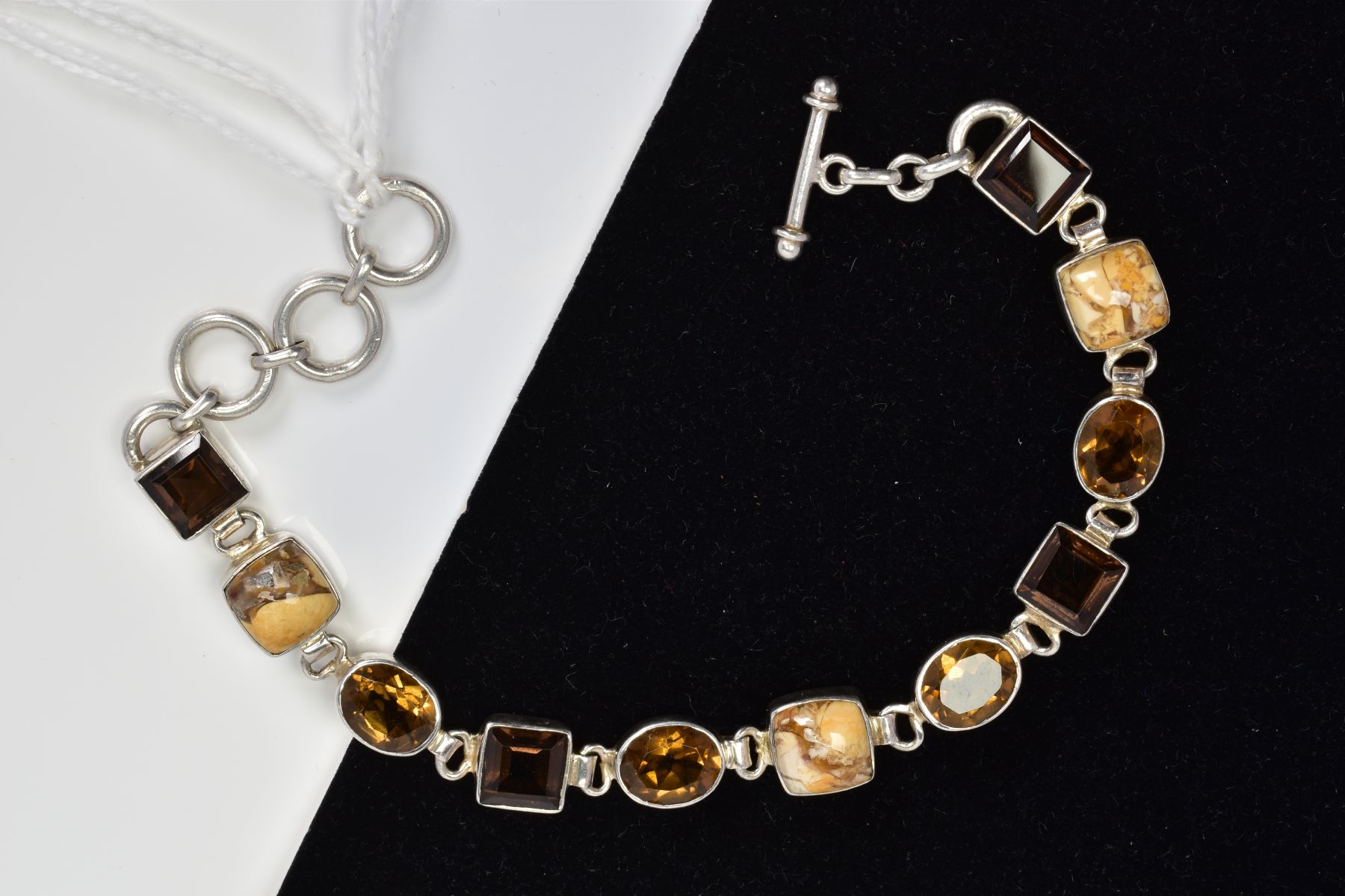 A MULTI GEM BRACELET, designed with collet set gems including square smokey quartz and oval citrine, - Image 2 of 3