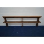 A PAIR OF EARLY 20TH CENTURY PITCH PINE BENCHES, length 295cm
