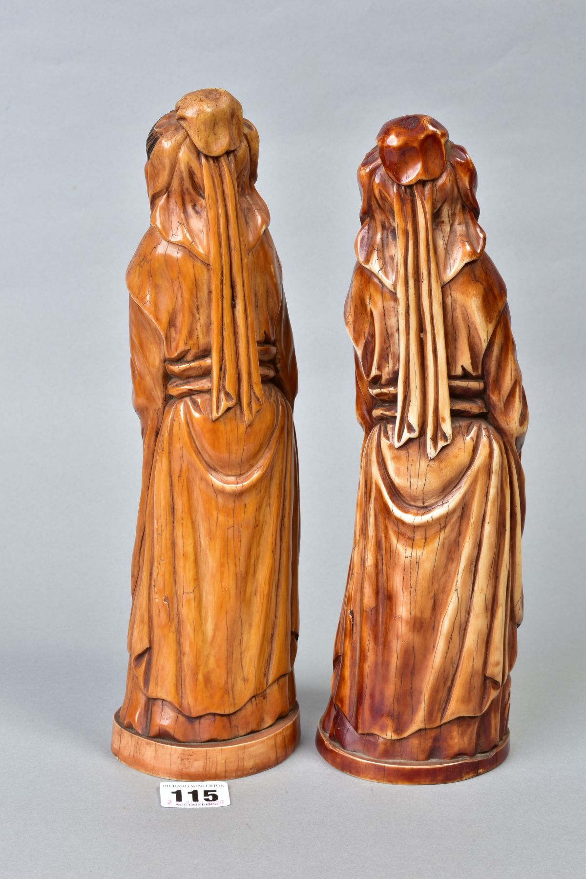 TWO NEAR IDENTICAL CHINESE CARVED AND BROWN STAINED IVORY FIGURES OF IMMORTALS, on oval bases with - Image 3 of 6