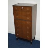 A TALL DARK TEAK 1950'S EGOMME G-PLAN TOLA AND BLACK CHEST OF SEVEN DRAWERS, width 61cm x depth 41cm