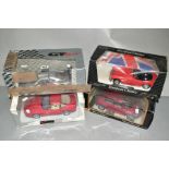 FOUR BOXED 1/18 SCALE SPORTS CAR MODELS, Ertl, Maisto and VT Models (condition: wear and damage to
