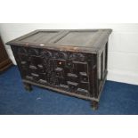 A 17TH CENTURY CARVED OAK JOINT COFFER, the hinged moulded cover above lunette carved frieze and
