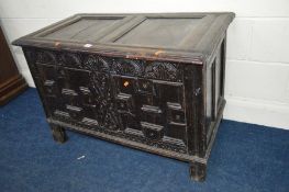 A 17TH CENTURY CARVED OAK JOINT COFFER, the hinged moulded cover above lunette carved frieze and