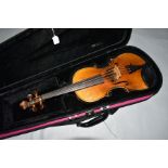 AN EARLY 20TH CENTURY GERMAN 3/4 SIZE VIOLIN with a two piece flamed back in modern case