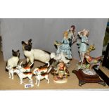 A COLLECTION OF BESWICK, HUMMEL AND OTHER ITALIAN FIGURINES, including two seal point Siamese cats