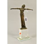 AN ART DECO STYLE BRONZE FIGURE OF A LADY, arms outstretched, signed Masier, mounted on a glass