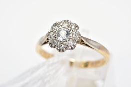 A CUBIC ZIRCONIA CLUSTER RING, designed as a circular colourless cubic zirconias to the tapered